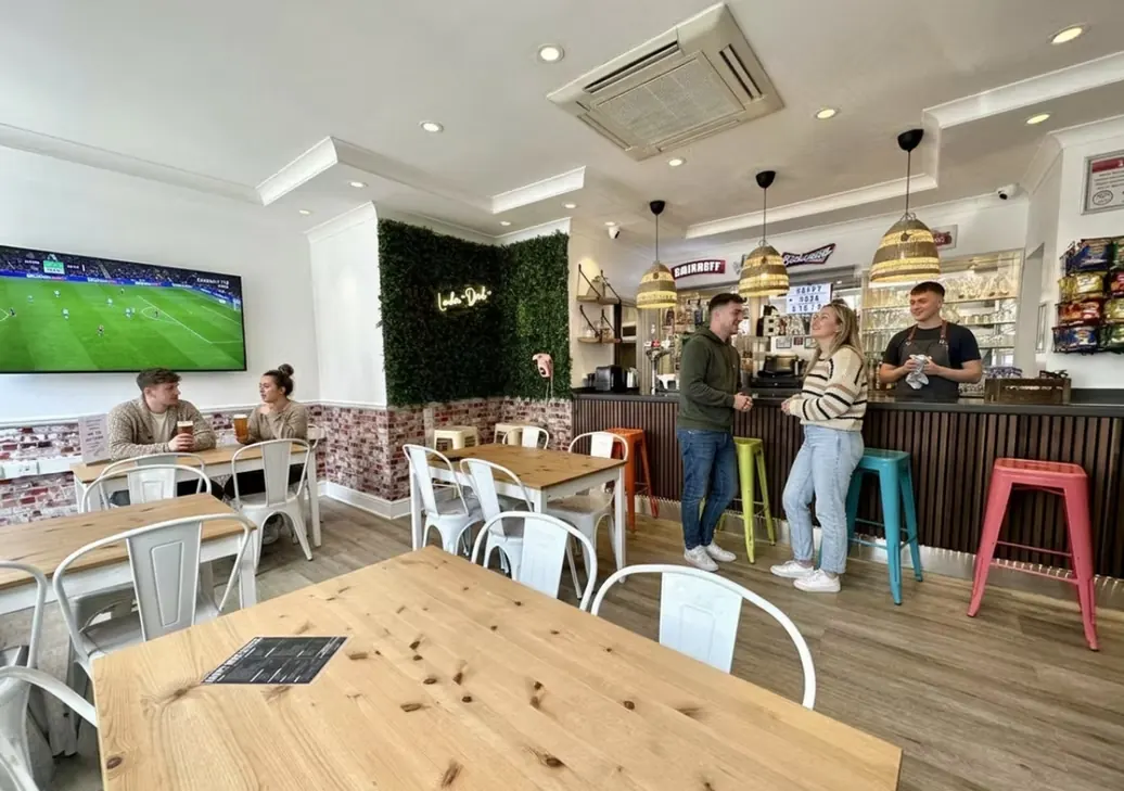Bar lounge with dining tables and big-screen TV