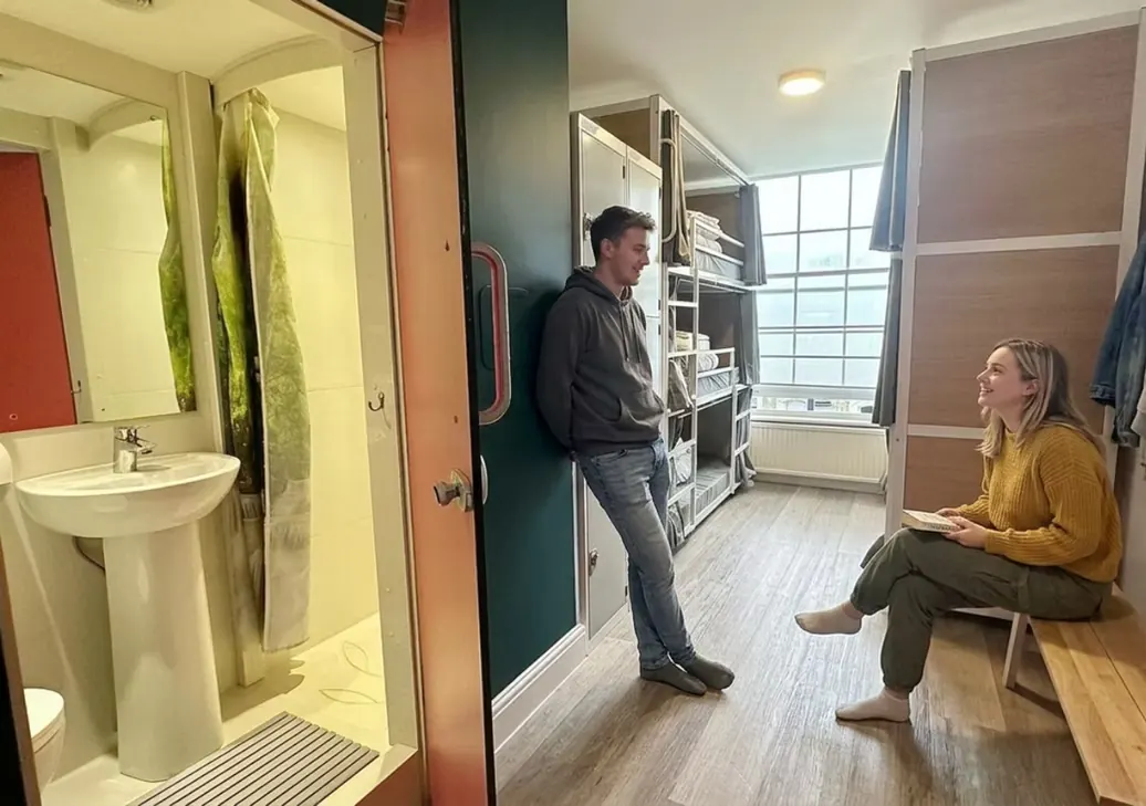 En-suite dorm room with shower and bunk beds