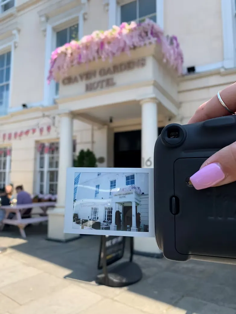 Polaroid of the hostel entrance in front of the building