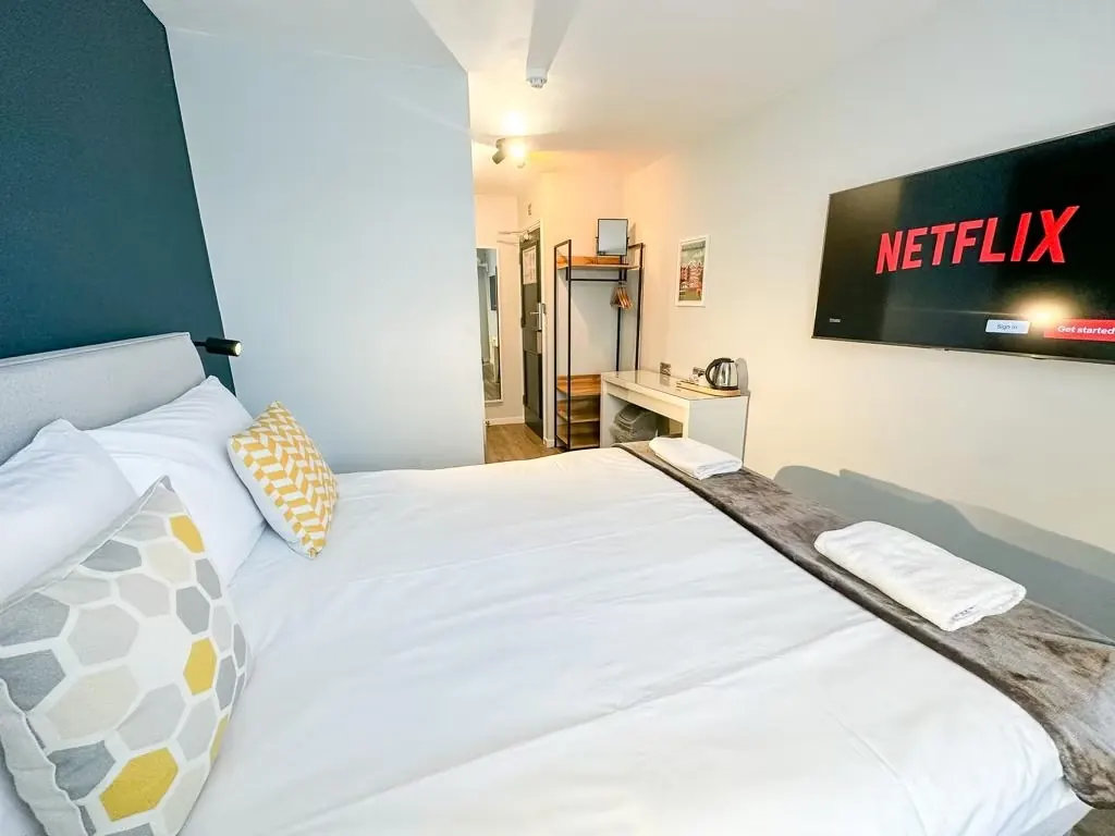 Private room with wall-mounted TV and Netflix